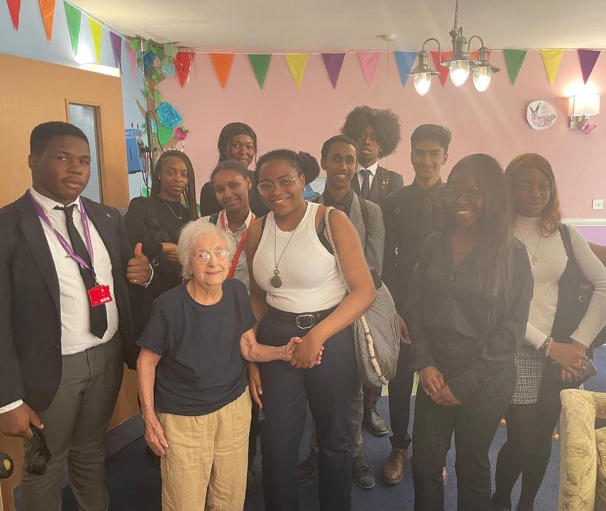 Group of students visiting a local care home